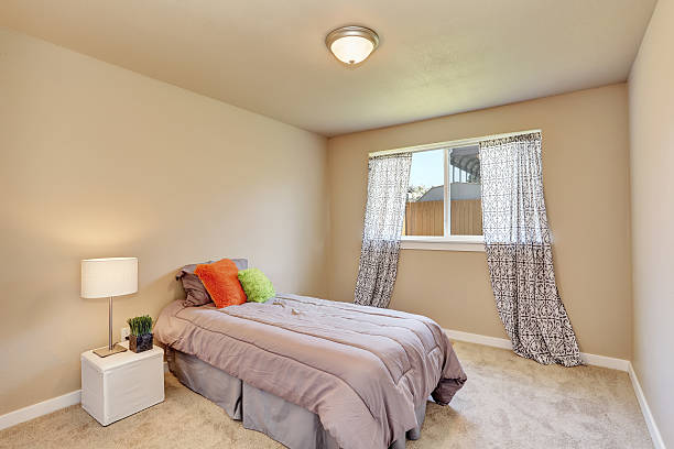 istock Modern teen bedroom interior with grey bedding. 590046332
