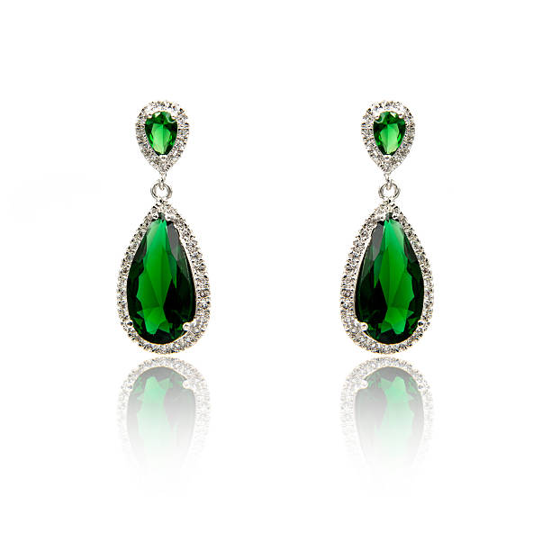 istock Pair of emerald earrings isolated on white 590046654