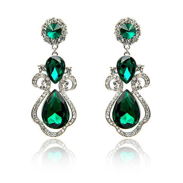istock Pair of emerald earrings isolated on white 590046804