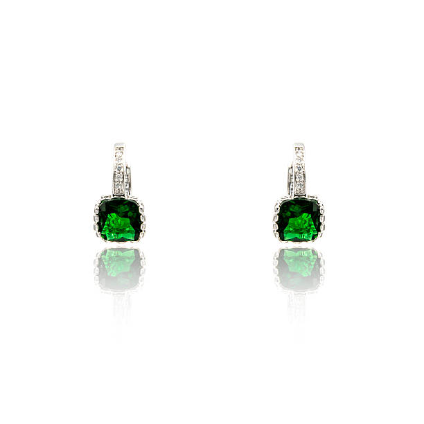 istock Pair of emerald earrings isolated on white 590046992