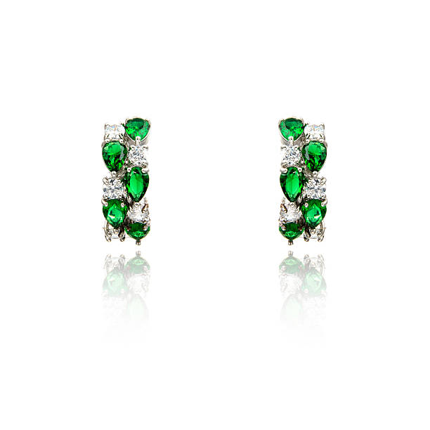 istock Pair of emerald earrings isolated on white 590047078