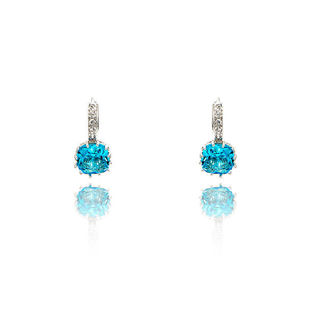 istock Pair of sapphire earrings isolated on white 590047396