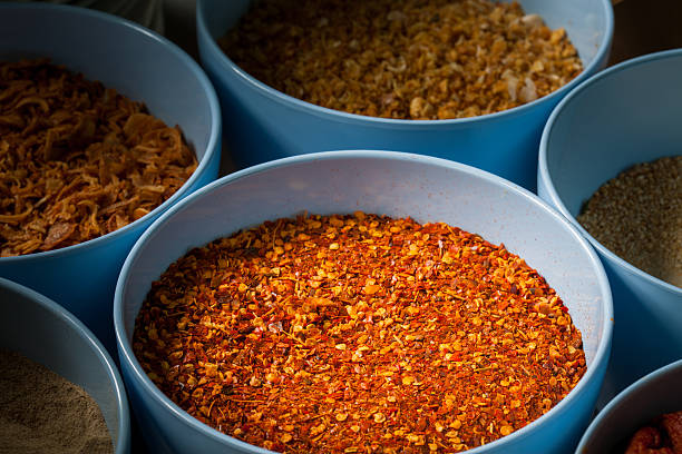 istock Cayenne pepper in blue cup at the kitchen 590047402