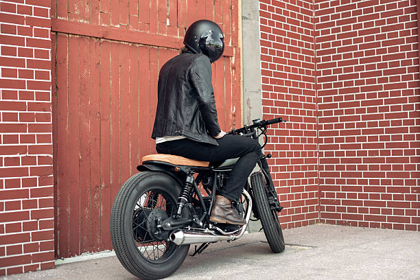 istock Biker and vintage custom motorcycle 590047526