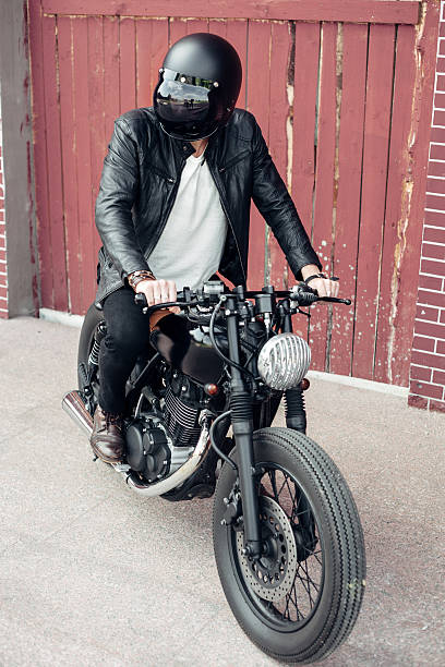 istock Biker and vintage custom motorcycle 590047772