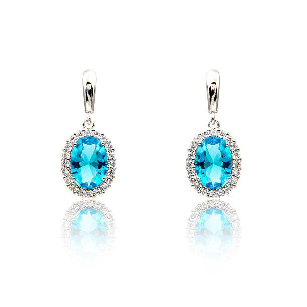 istock Pair of sapphire earrings isolated on white 590047926