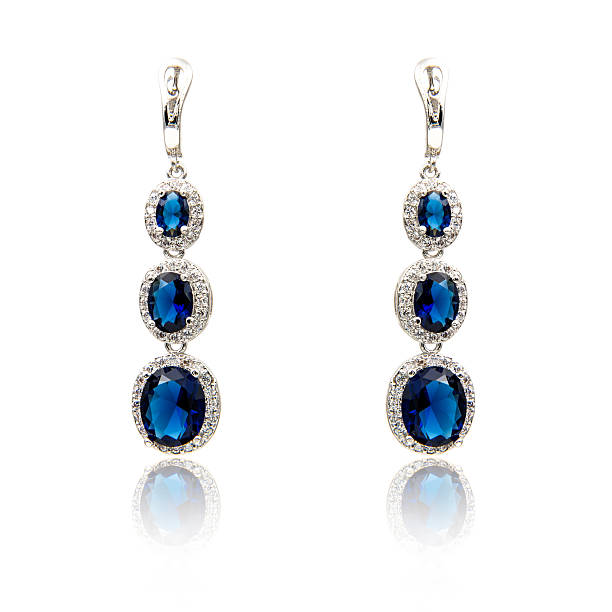 istock Pair of sapphire earrings isolated on white 590047970