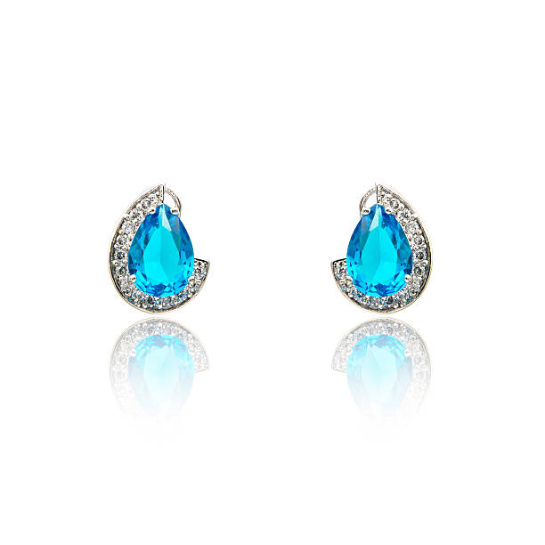 istock Pair of sapphire earrings isolated on white 590048008