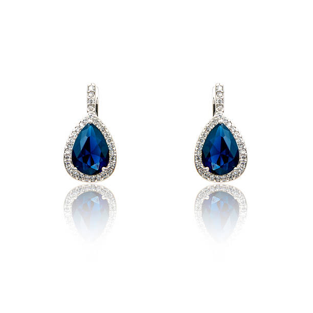 istock Pair of sapphire earrings isolated on white 590048054