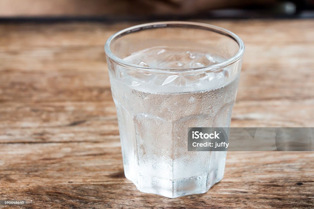 Glass of water A Glass of water on wooden table  Drinking Glass Stock Photo