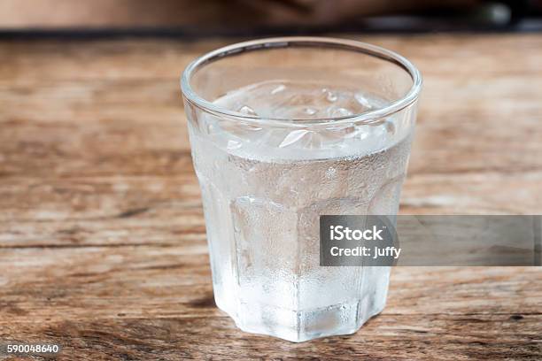 Glass Of Water Stock Photo - Download Image Now - Drinking Glass, Ice, Table