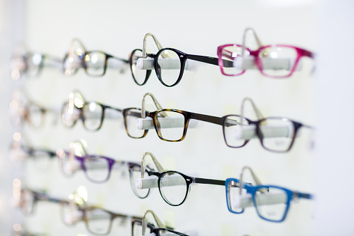 Close-up of various spectacles on display in optical store