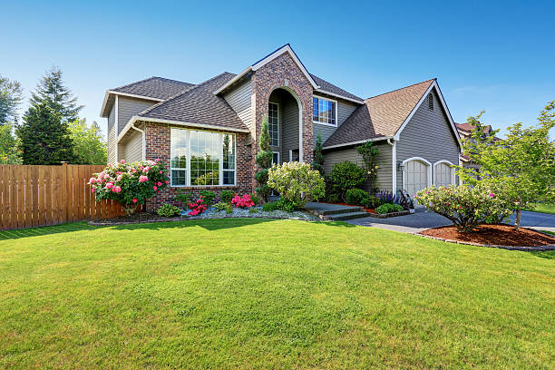 istock Luxury house with brick and siding trim and double garage. 590051094