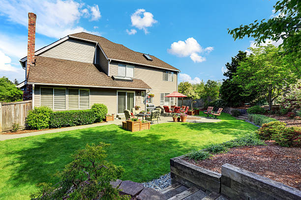 istock Well kept garden at backyard with concrete floor patio area 590052044