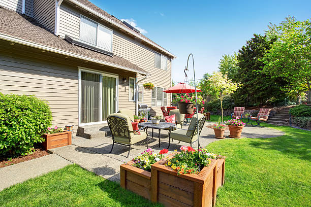 istock Well kept garden at backyard with concrete floor patio area 590052168