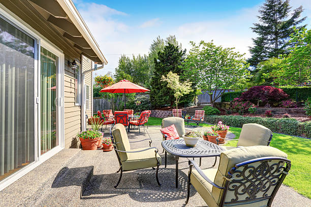 istock Well kept garden at backyard with concrete floor patio area 590052252