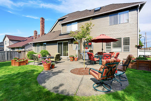 istock Well kept garden at backyard with concrete floor patio area 590052418