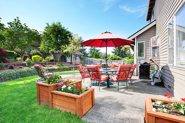 istock Well kept garden at backyard with concrete floor patio area 590052524