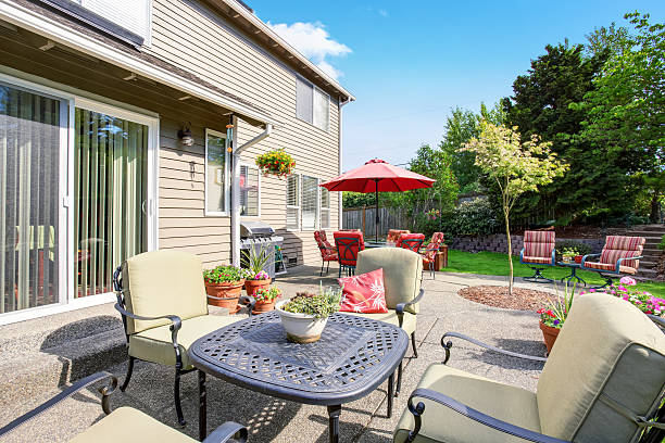 istock Well kept garden at backyard with concrete floor patio area 590053120