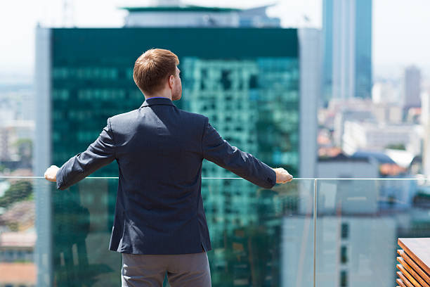istock Businessman Looking at City 590053268