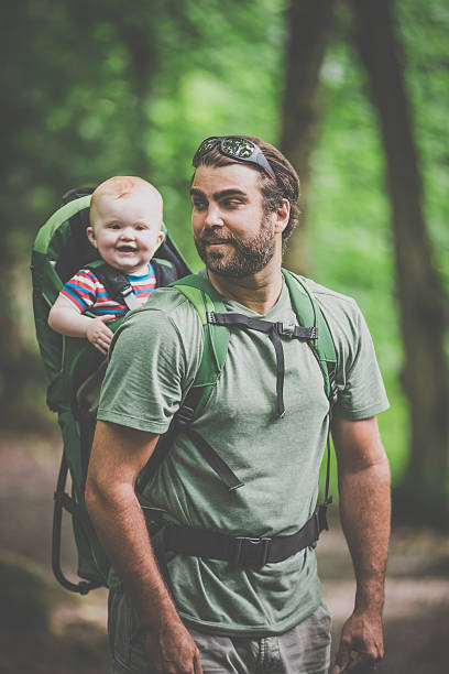 istock Father Backpacking Hiking with Baby in Forest 590053270