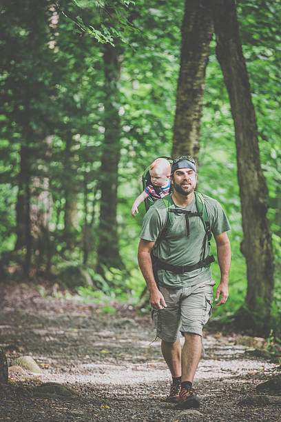 istock Father Backpacking Hiking with Baby in Forest 590054958