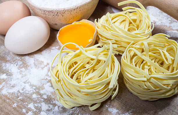 istock Raw homemade pasta and ingredients for pasta. 590056040