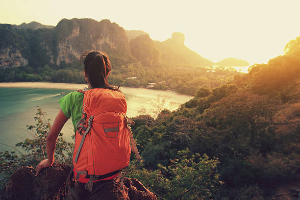 istock young  woman enjoy the view on mountain peak 590056102