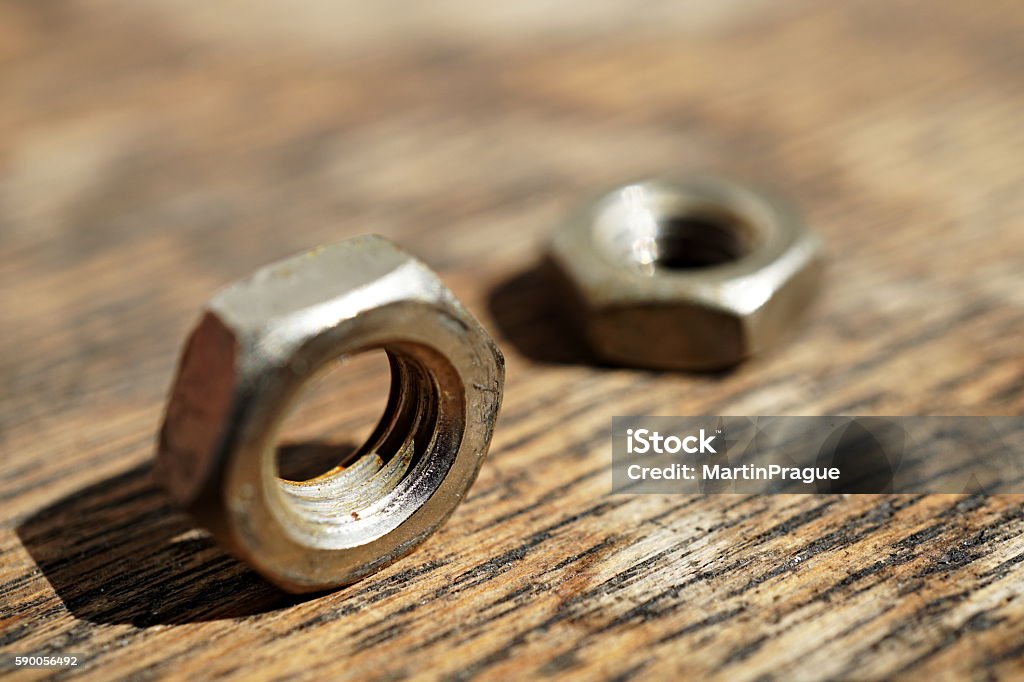 Macro detail of a siver metal small nut (Replacement nut) Aluminum Stock Photo