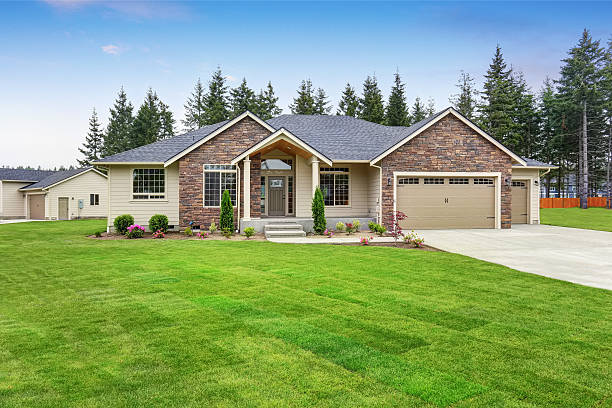 istock Luxury one level house exterior with brick trim and garage 590057824