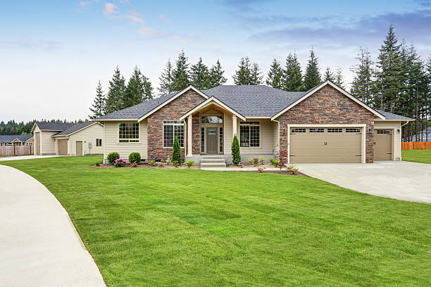 istock Luxury one level house exterior with brick trim and garage 590058068