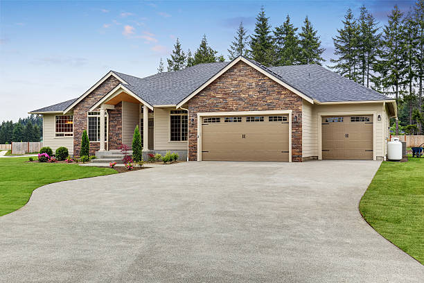 istock Luxury one level house exterior with brick trim and garage 590058176