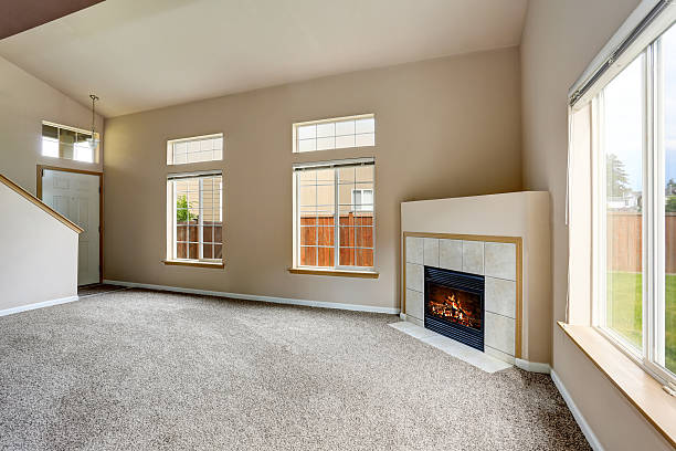 istock Empty living room interior in light tones and fireplace 590059568