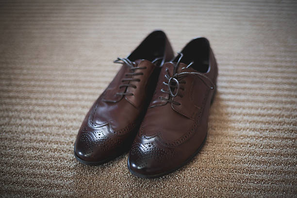 istock Pair of classic brown leather male shoes 590059924