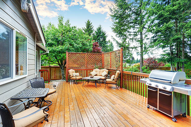 istock Spacious wooden deck with patio area and attached pergola. 590060090