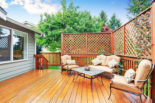 istock Spacious wooden deck with patio area and attached pergola. 590060466