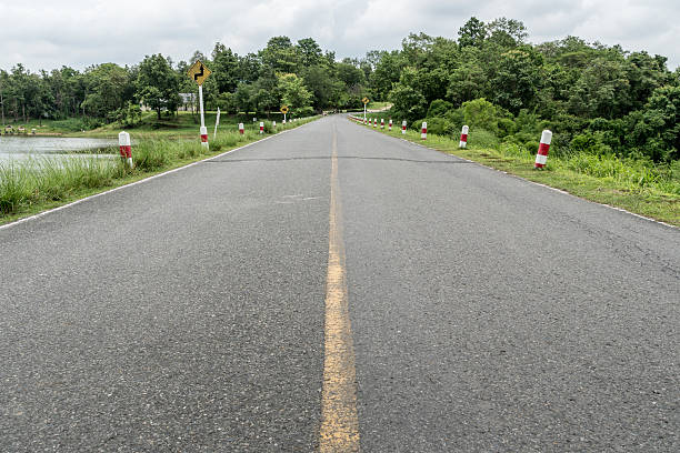 istock Asphalt road with yellow line 590061706