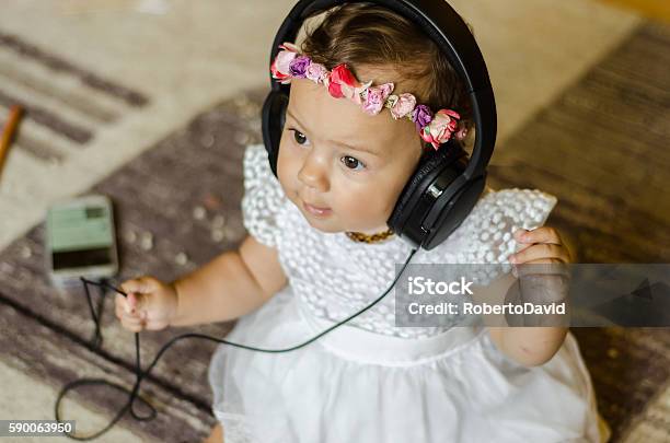 Baby Listening To Music On Headphones Stock Photo - Download Image Now - Arts Culture and Entertainment, Audio Electronics, Babies Only
