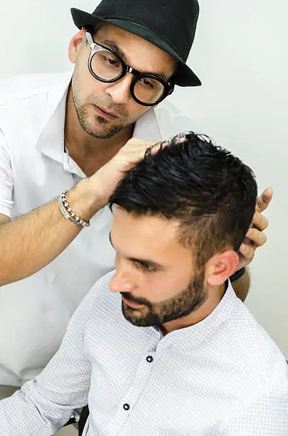 Photo of businessman and popular hairdresser