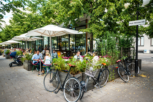 Stockholm, Sweden - July 31, 2016: People relaxing in a cafe, Stockholm, Sweden