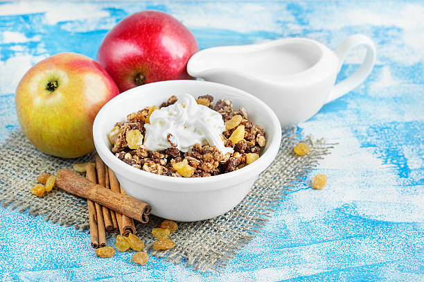 istock Crunchy muesli for breakfast, fresh red apples with cinnamon 590065882