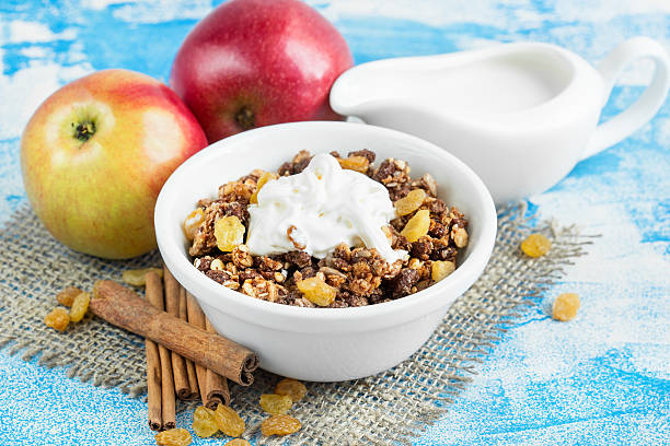 istock Muesli for breakfast, fresh red apples with cinnamon 590065956