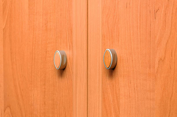 istock Close-up cupboard wood door, cabinet in kitchen 590066194