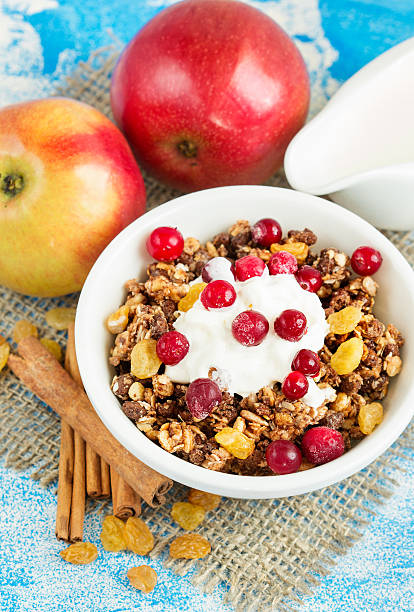 istock Muesli for breakfast, fresh apples with cinnamon and cream 590066238