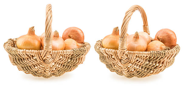 istock onions in a basket isolated on white background. 590067210