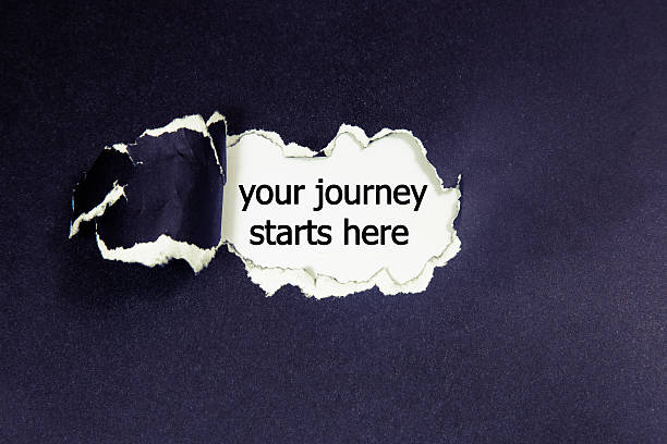 istock your journey starts here written under torn paper 590067462