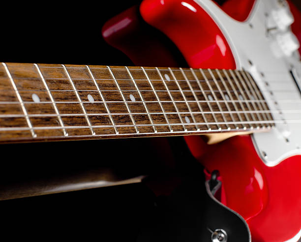istock Red electric guitar on black background 590067592