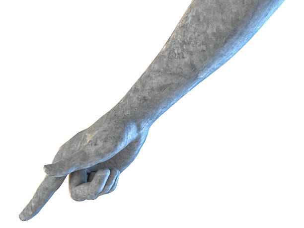 A white statue of a hand with a blue sky in the background. The statue is of Jesus Christ