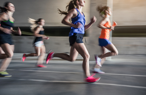 Group of young woman running outdoors