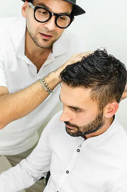 Photo of businessman and popular hairdresser